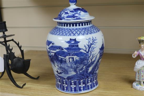 A late 19th century Chinese blue and white lidded baluster vase